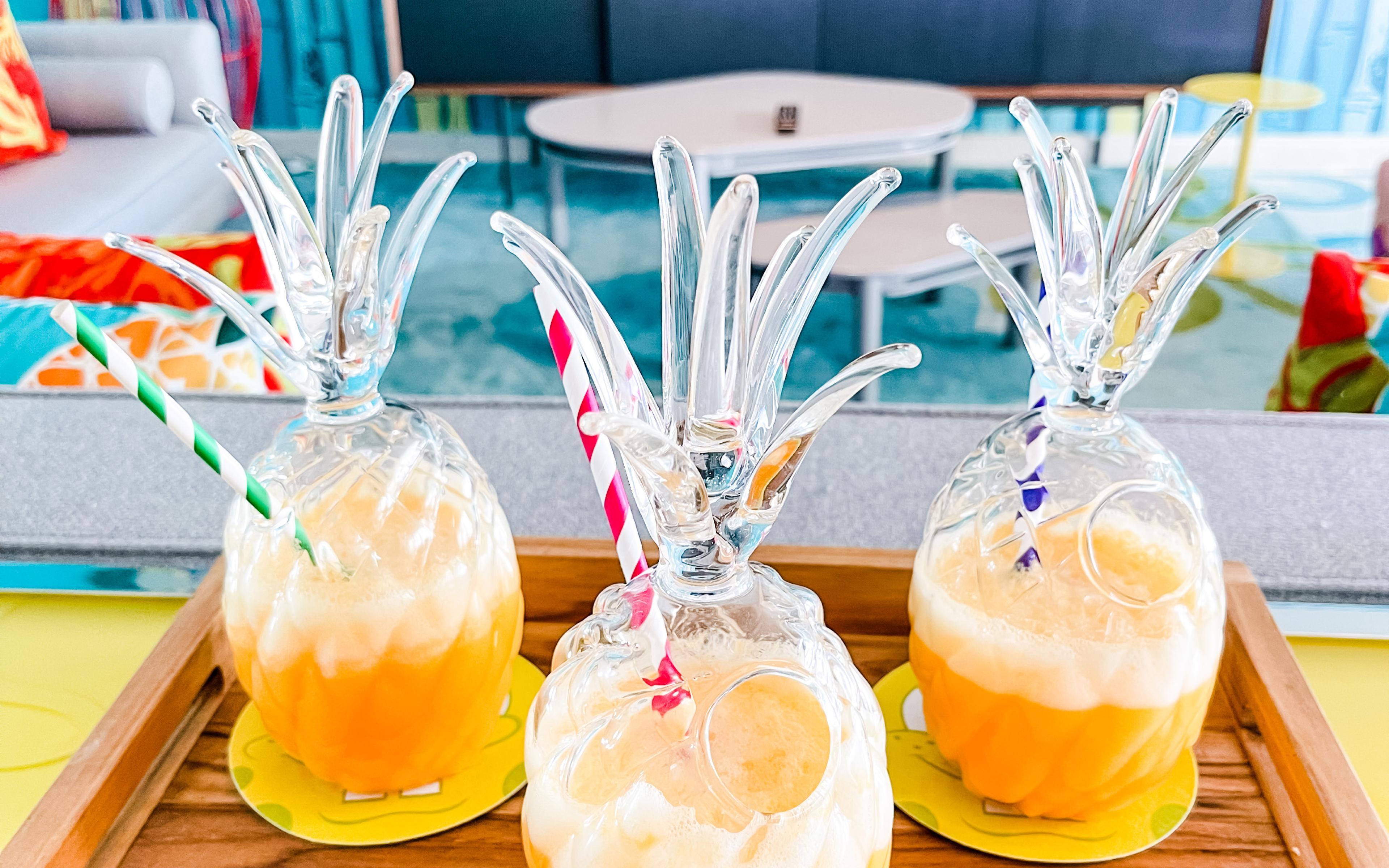 Tropical drinks in pineapple-shaped glasses