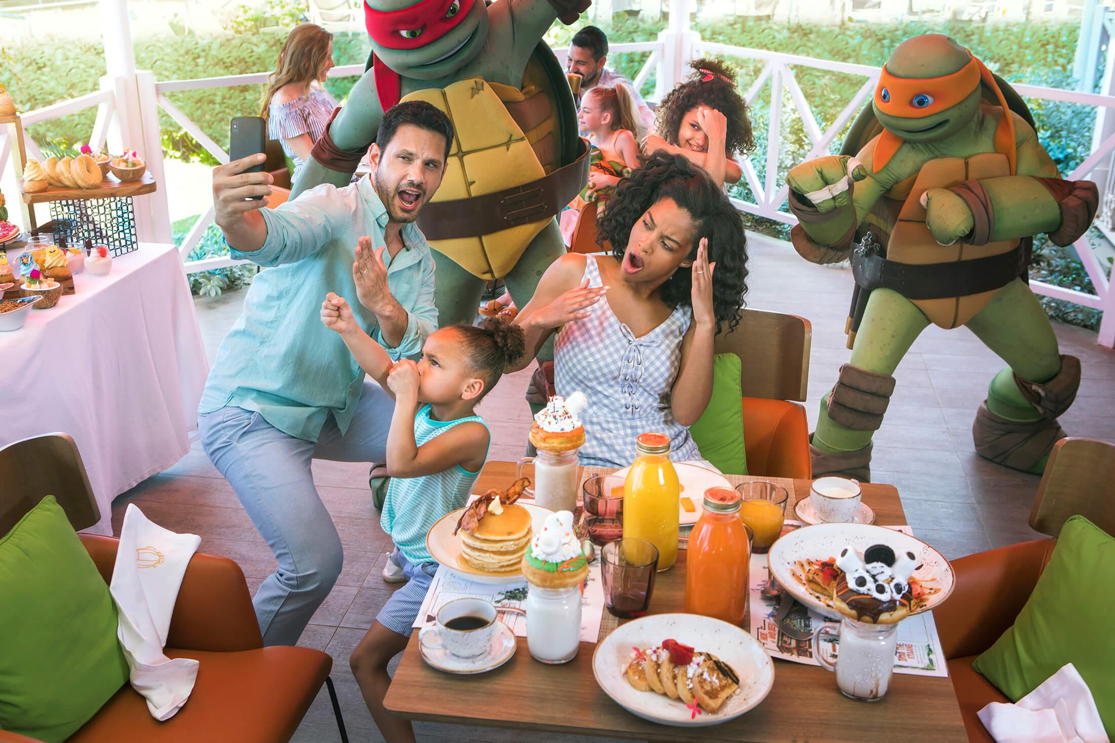 Family taking a selfie with ninja turtles