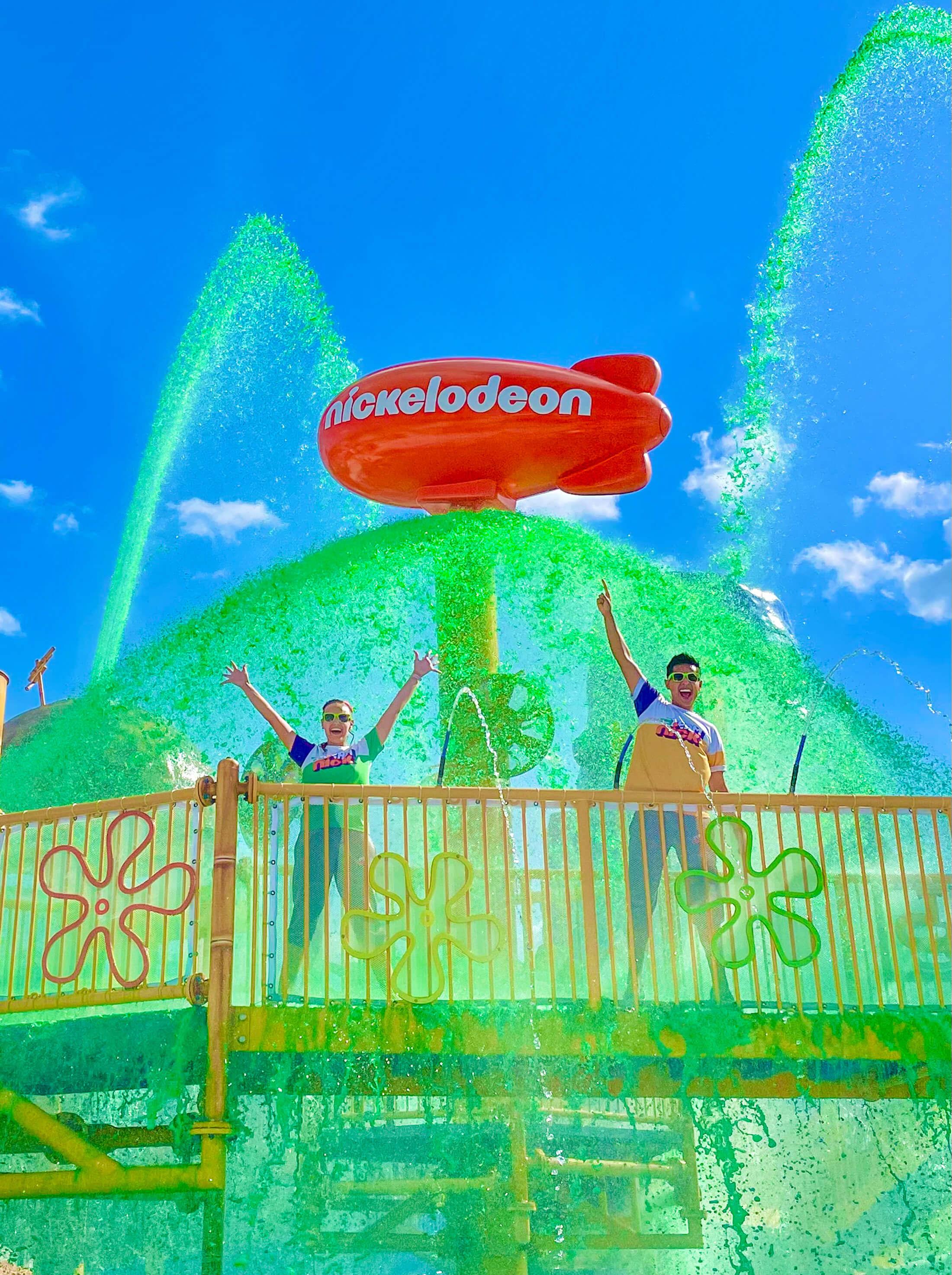 Nickelodon staff standing in front of Nickelodeon Blimp statue