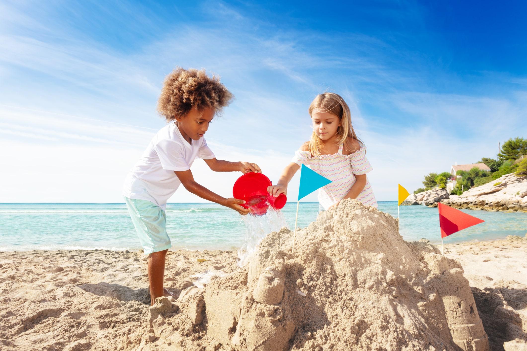 Children making sand castles on the beach