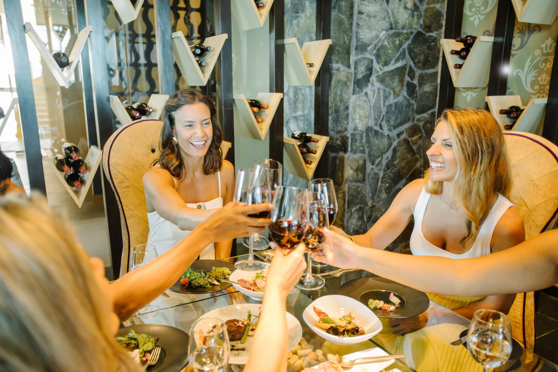 Women toasting at a restaurant table