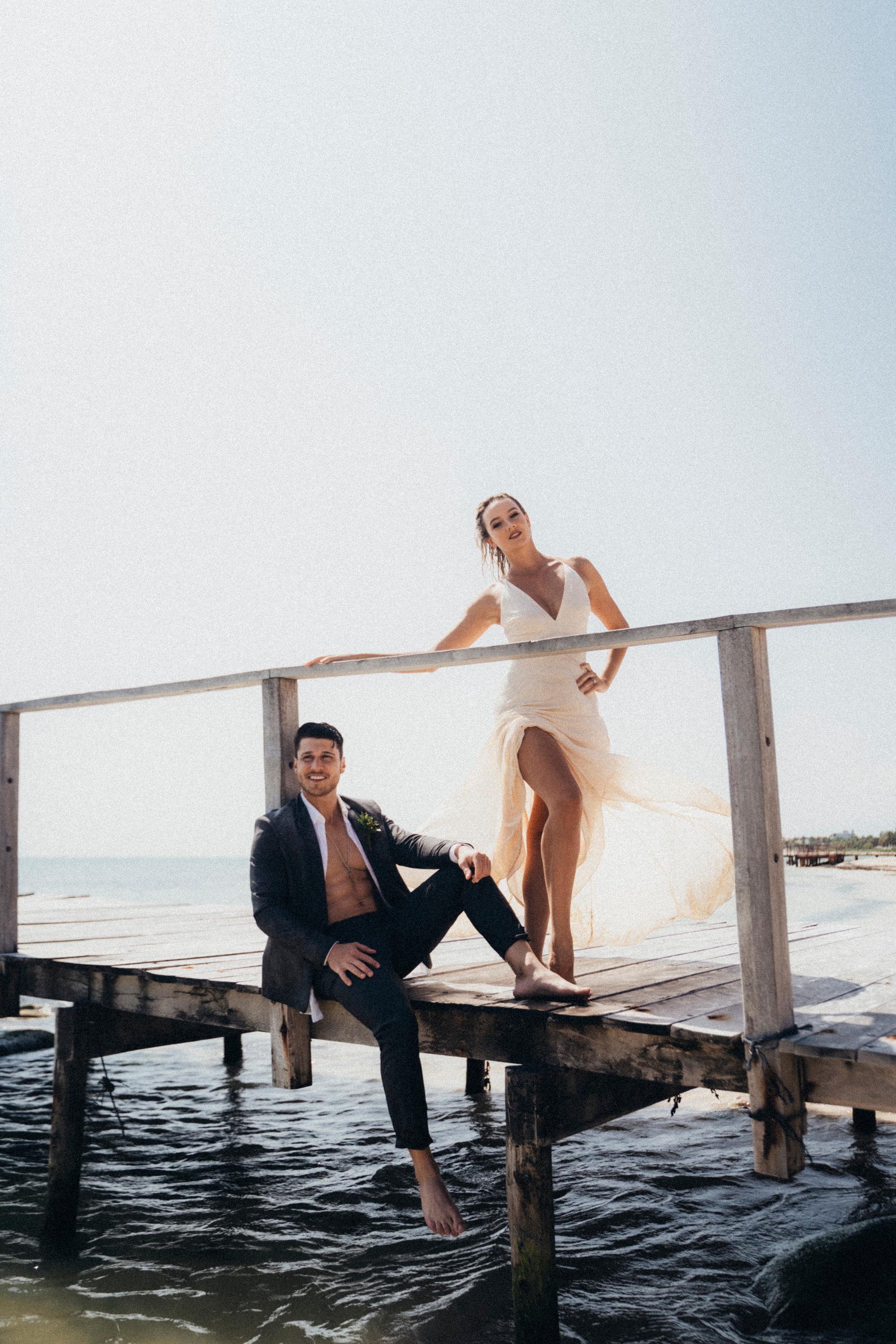 Bride and groom on a dock