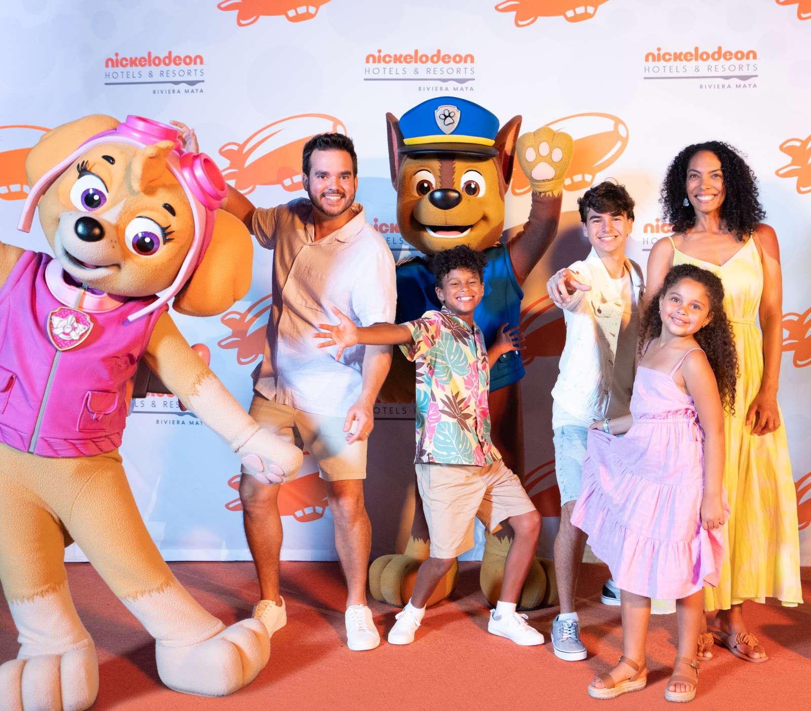 Family with Paw Patrol in orange carpet