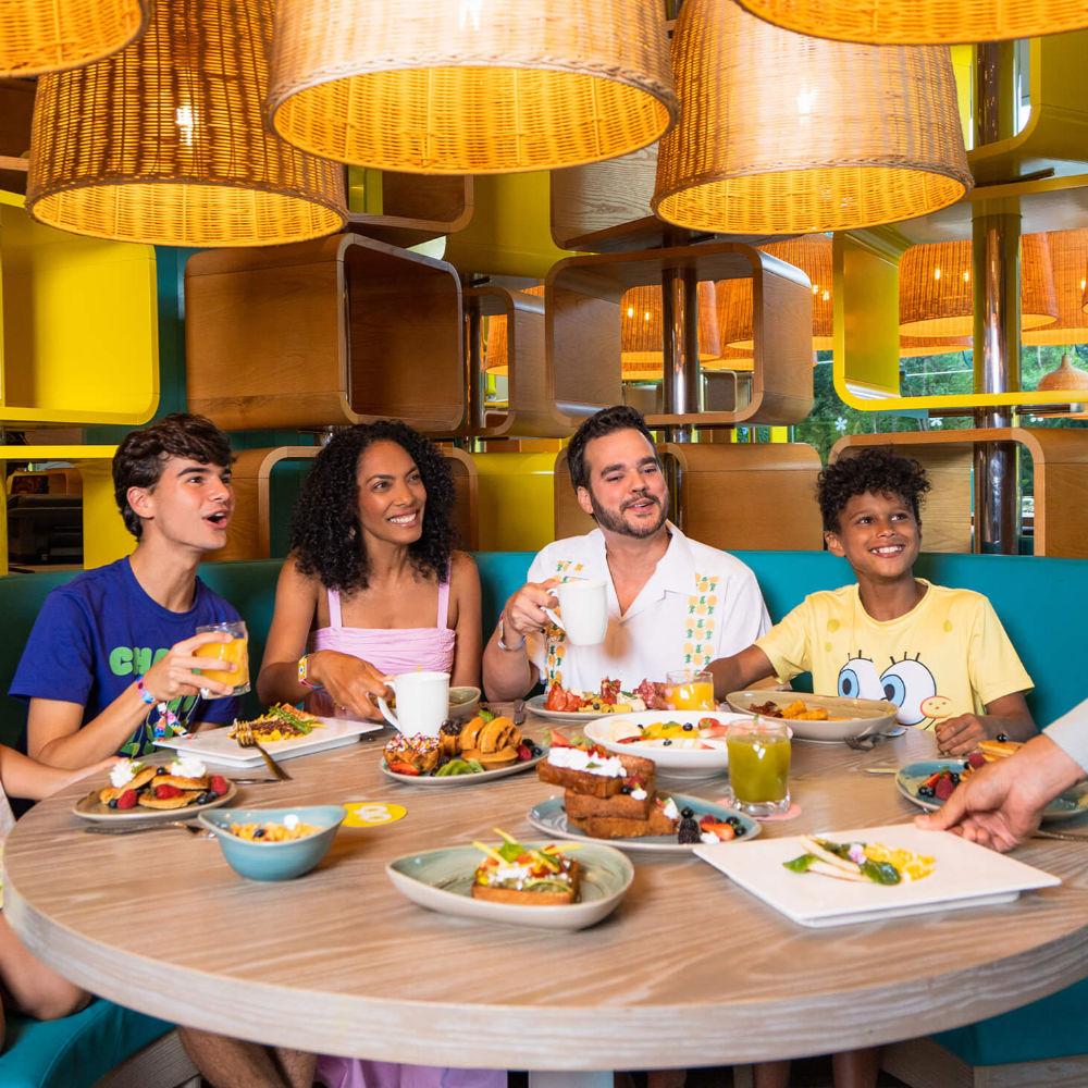 family dining in a Nickelodeon-themed restaurant
