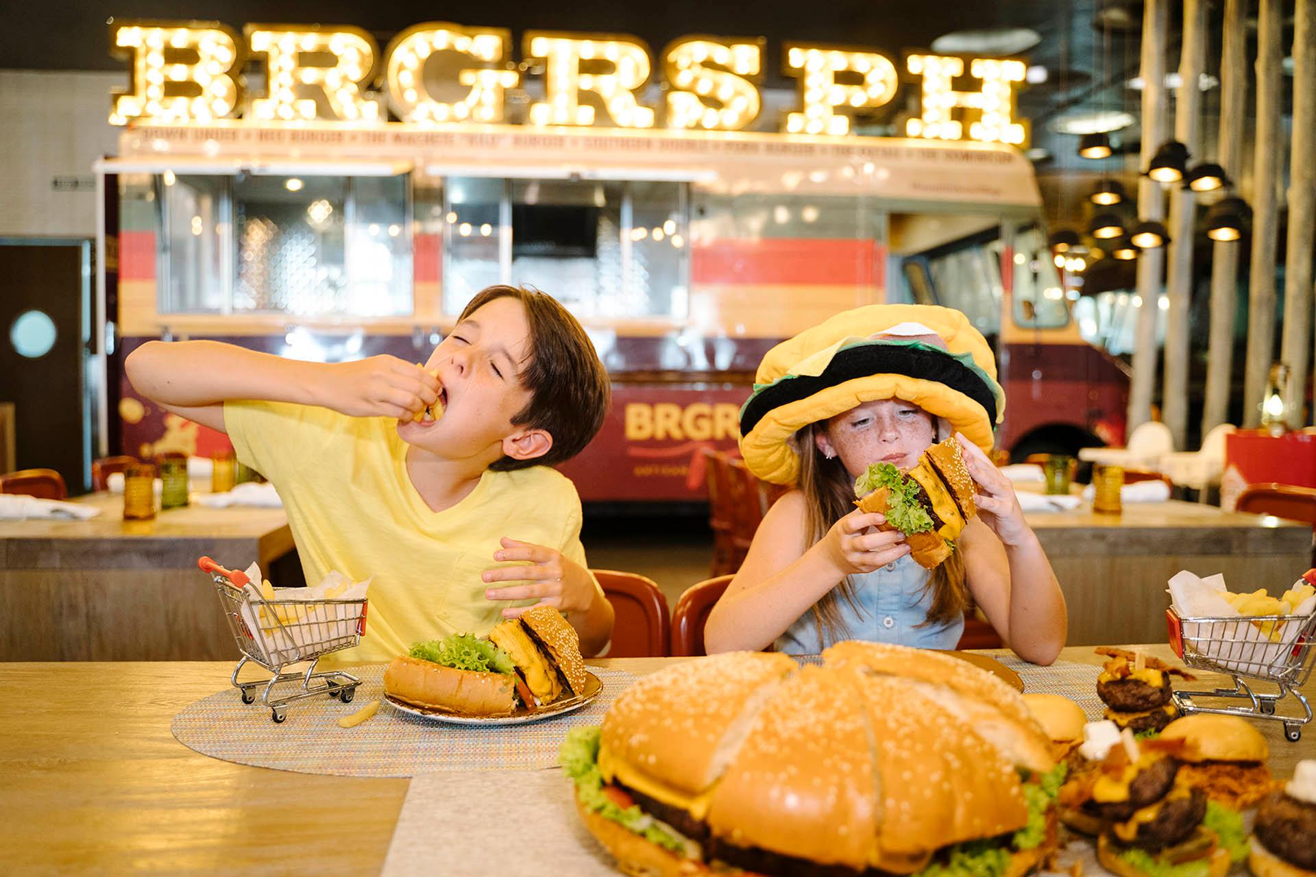 kids eating a hamburger