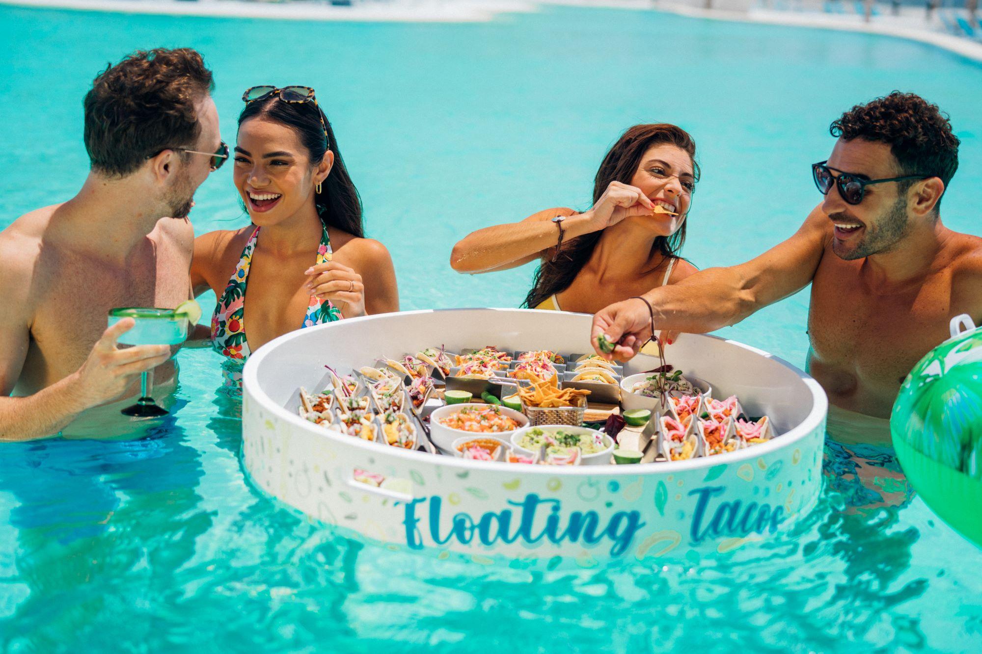Friends with floating taco in a pool