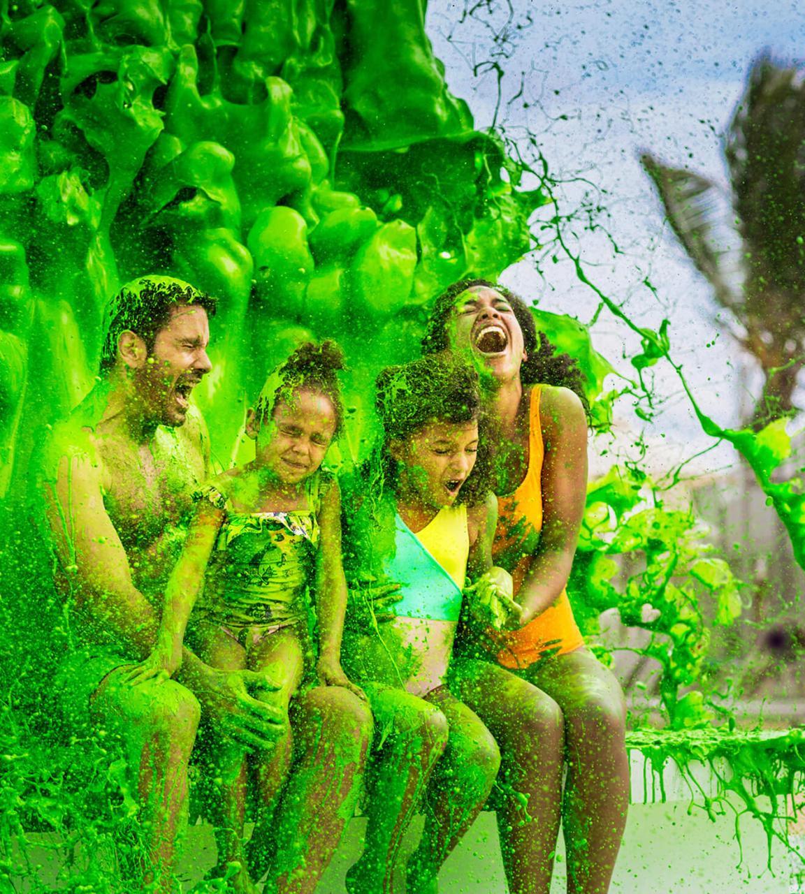 Family being splashed with slime