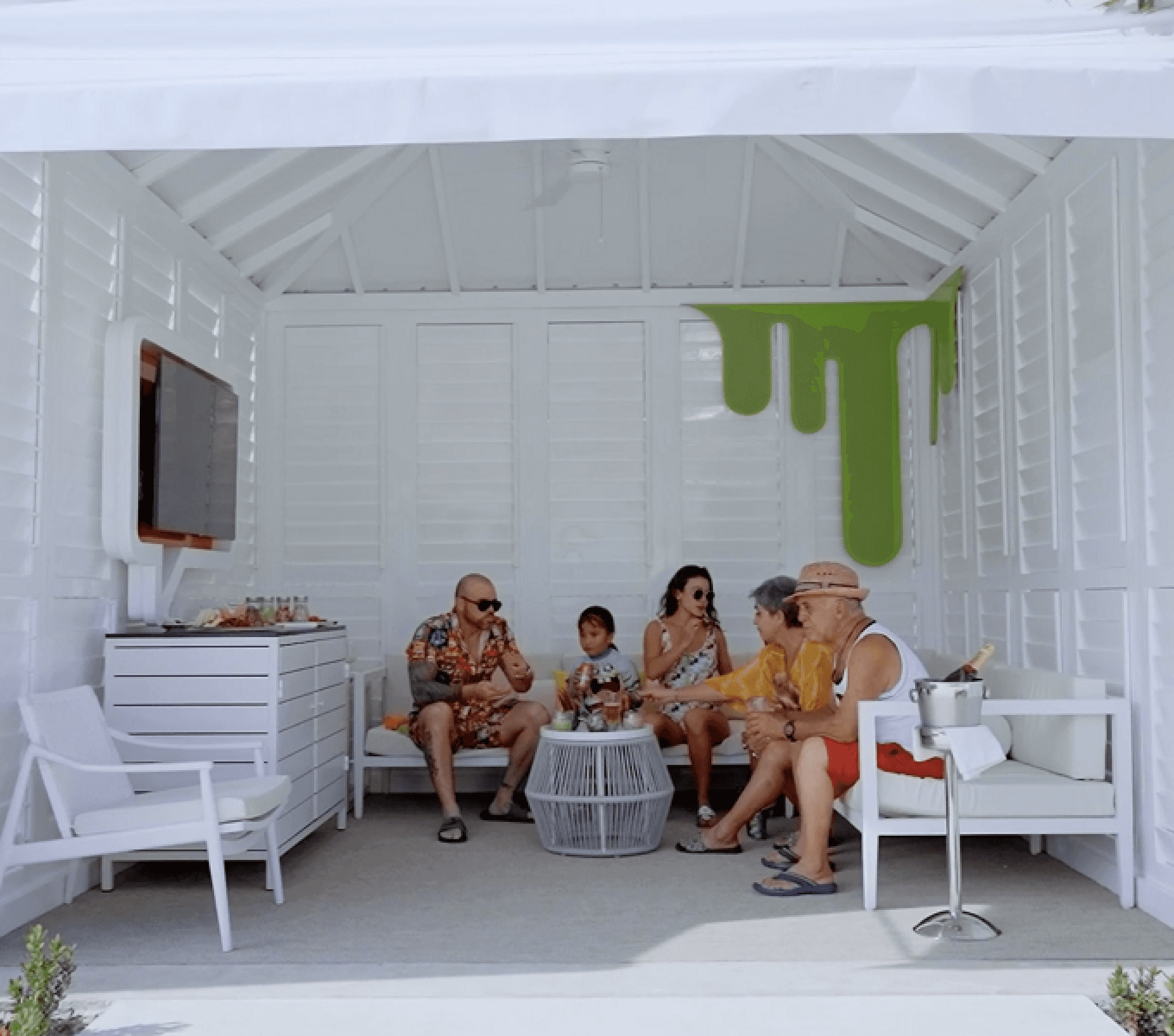 A family dines in a cabana