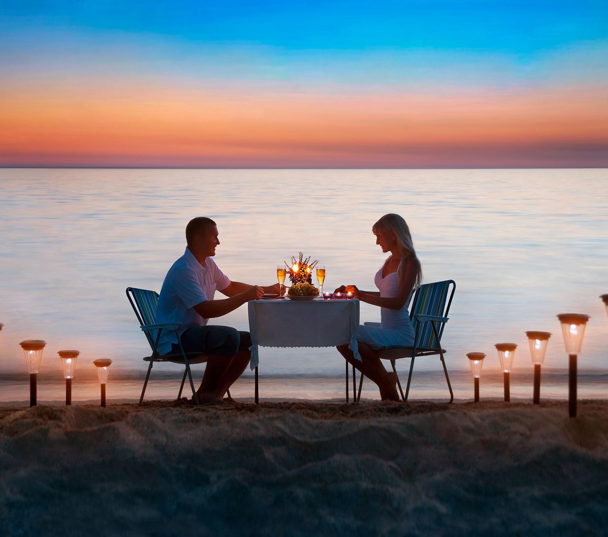 Couple having romantic dinner at the beach