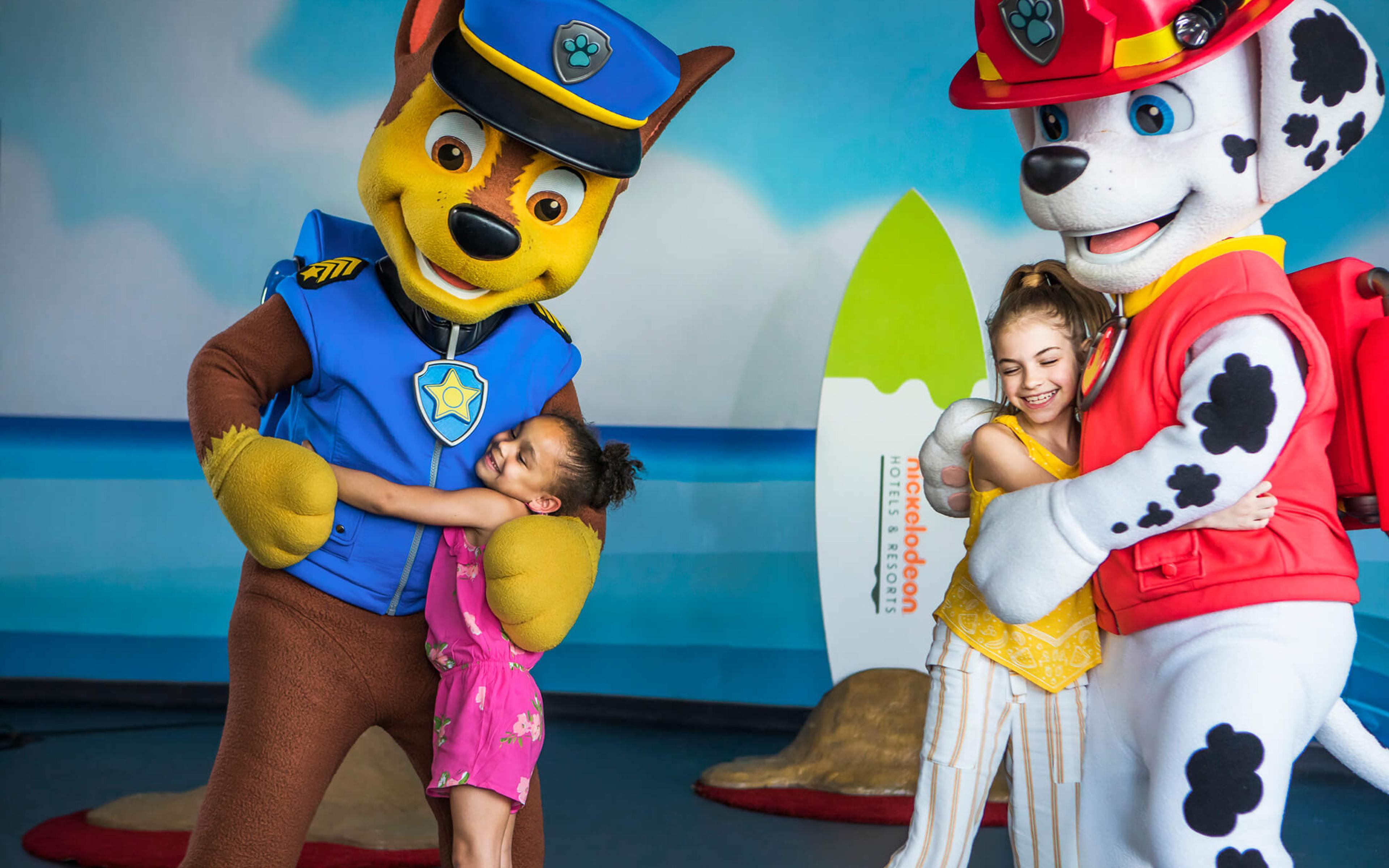 Paw patrol characters posing with child