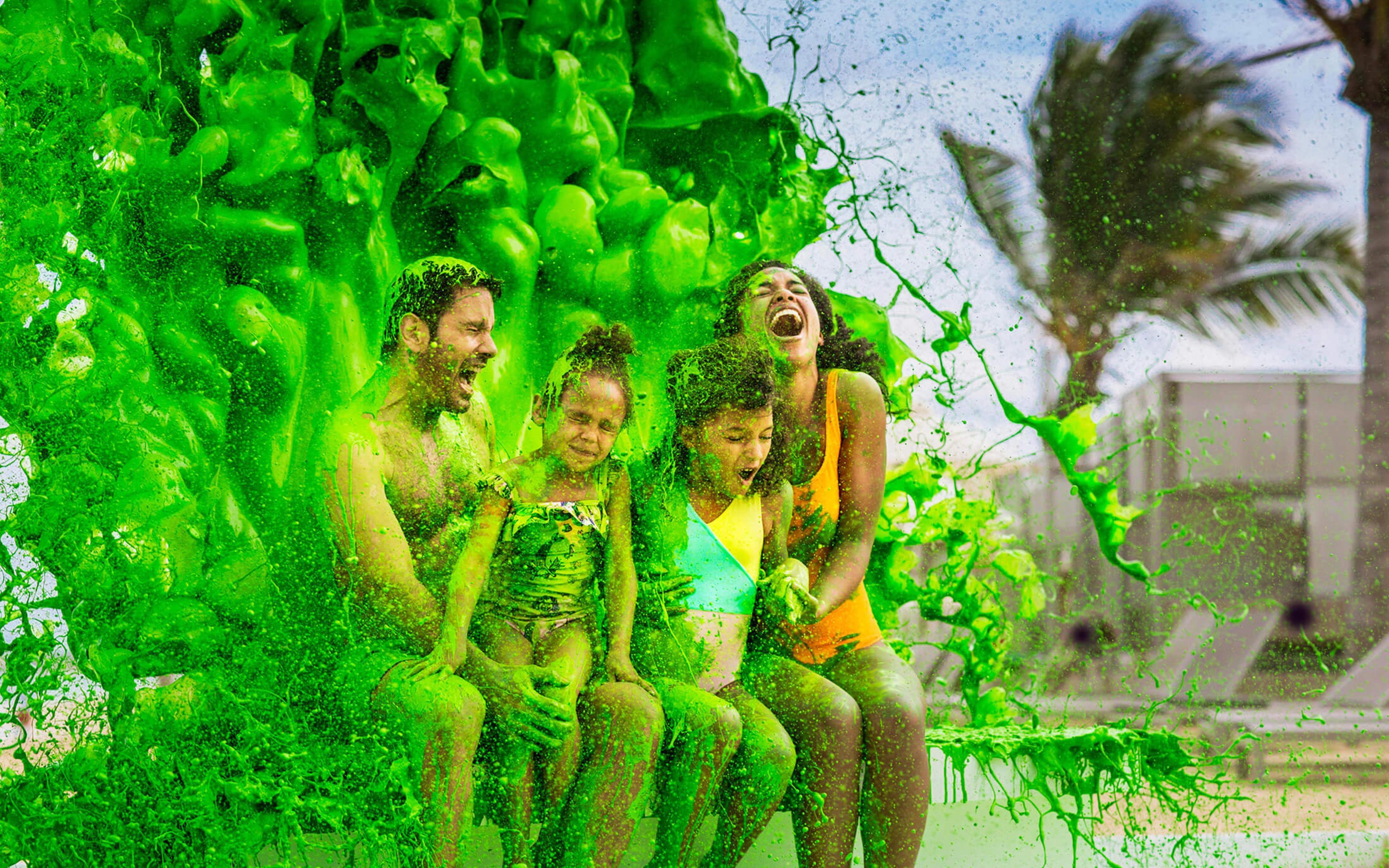 Family being splashed with slime