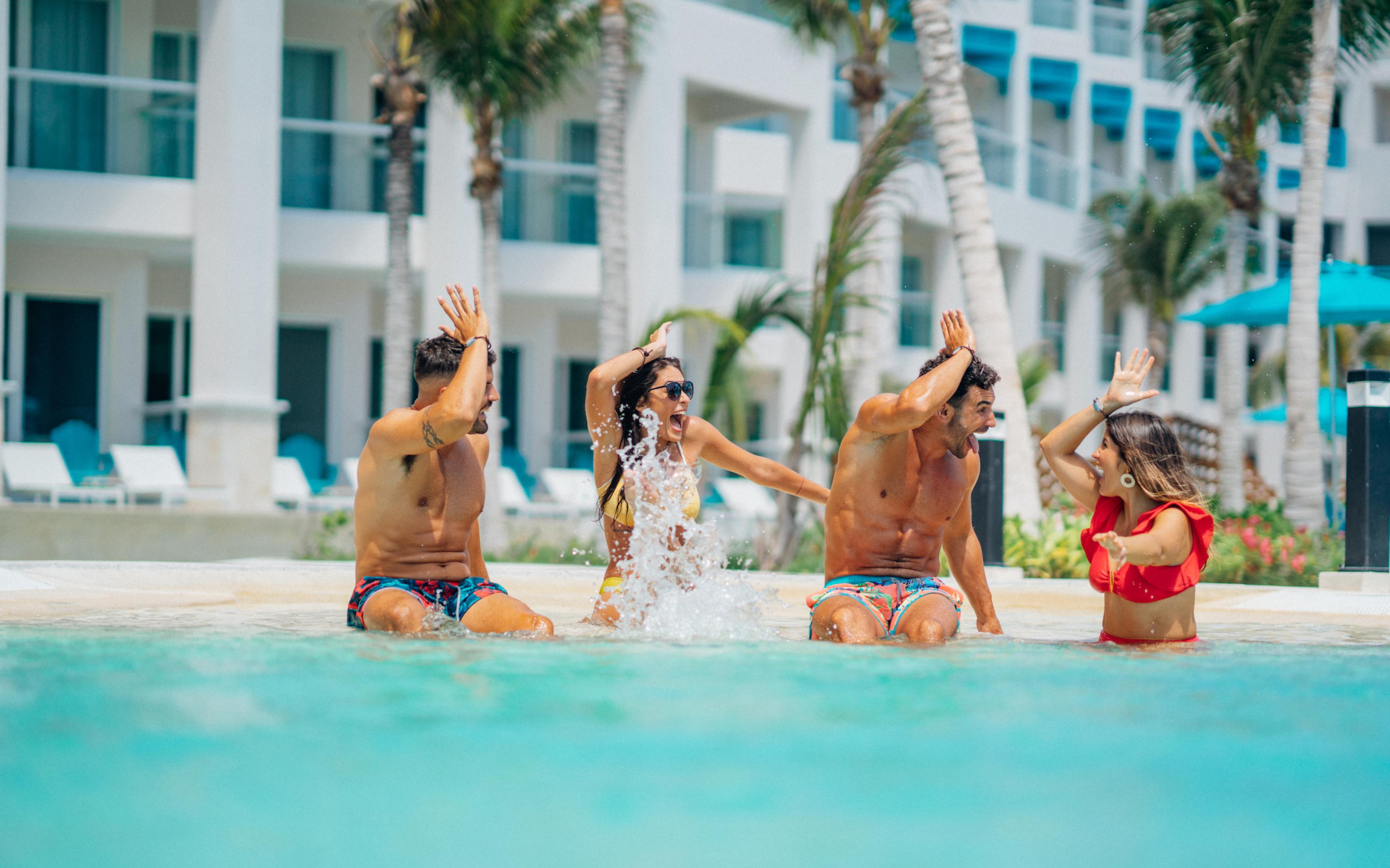 Friends splash at a Margaritaville resort pool