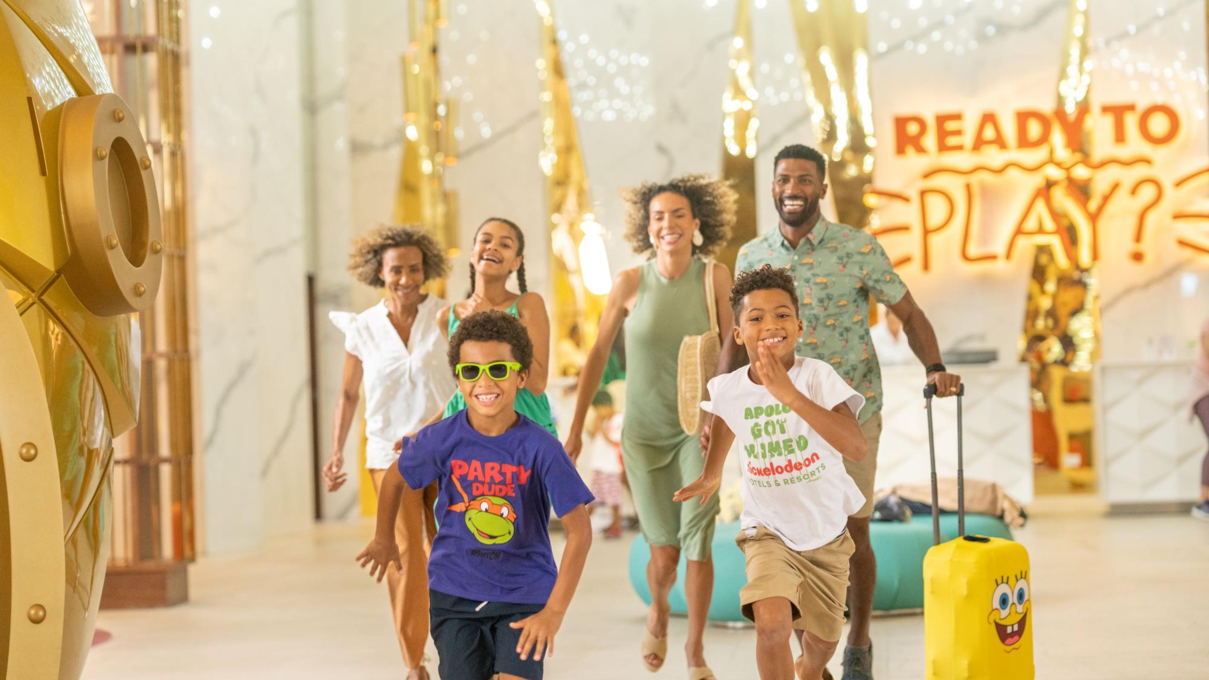 a family running in a Nickelodeon Resort