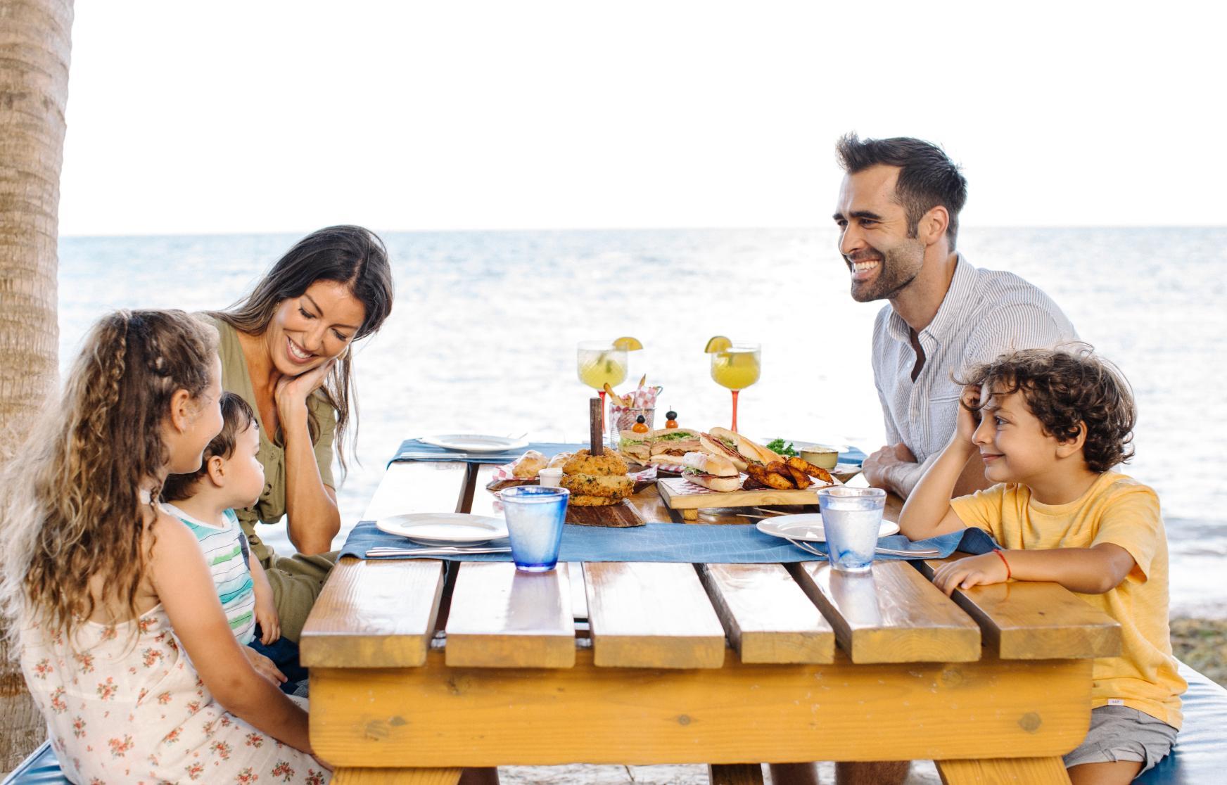 Family having breakfast at the beach